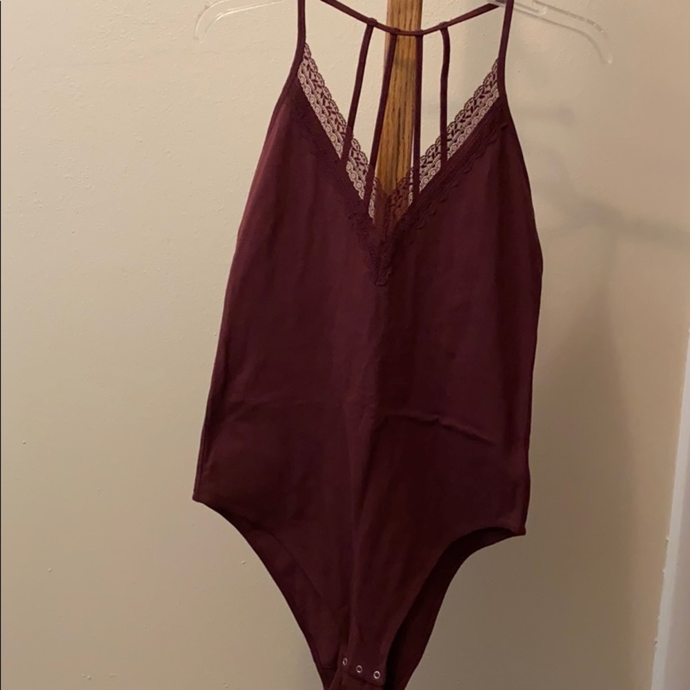 Maroon bodysuit with lace and strappy back. NWOT